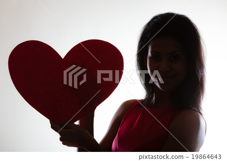Girl mixed race with paper red heart 19864643