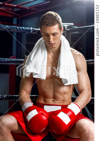 Cheerful boxing champion is having a rest Cheerful boxing champion is having a rest 19865152