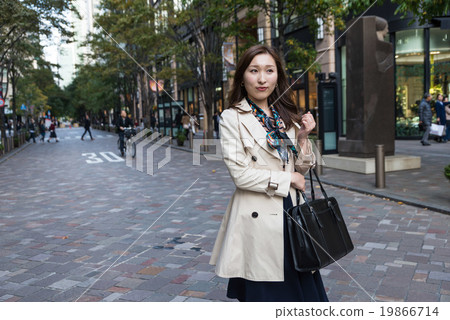 A woman walking on a coat A woman walking on a coat 19866714