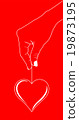 Heart in hand on red 19873195