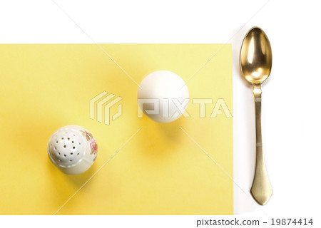 egg, salt cellar and brass spoon 19874414