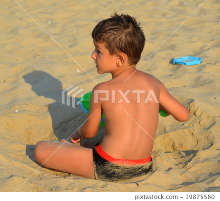 Kid on the beach Kid on the beach 19875560