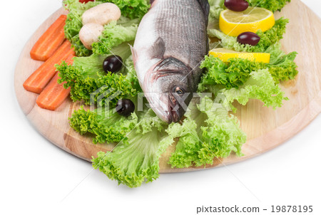 Fresh seabass fish on lettuce. Fresh seabass fish on lettuce. 19878195