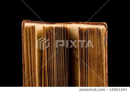 ancient book shot on black background ancient book shot on black background 19881264