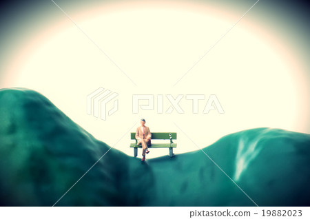 A businessman sitting on a bench sadly 19882023