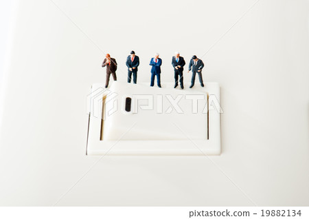 Businessmen looking at the switch Businessmen looking at the switch 19882134
