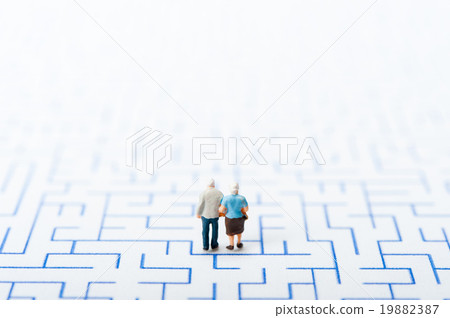The elderly couple walking in the maze The elderly couple walking in the maze 19882387