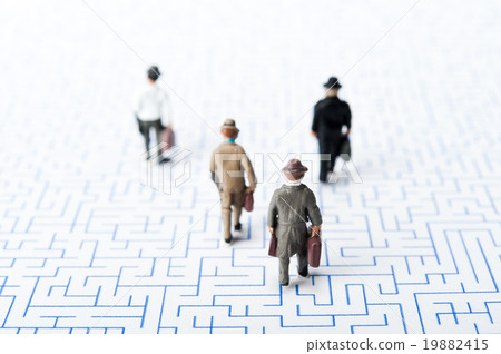 A businessman walking in the maze 19882415