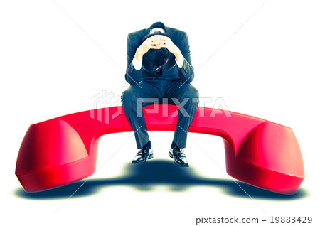 Men sitting on a red handset, trouble 19883429