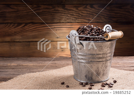 full coffee beans in zinc bucket 19885252