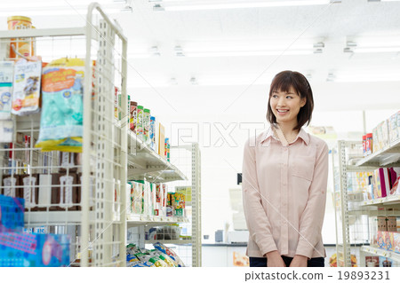 A woman shopping at a convenience store A woman shopping at a convenience store 19893231