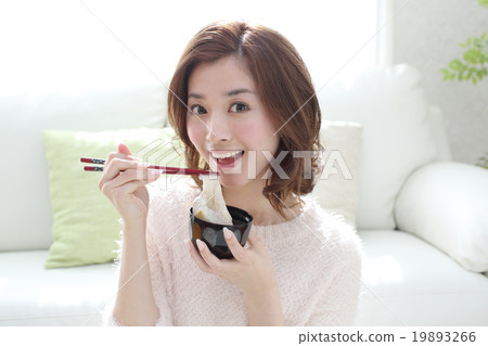Girls eating soup stock 19893266