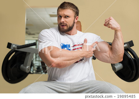 Strong man with huge muscles. 19895485