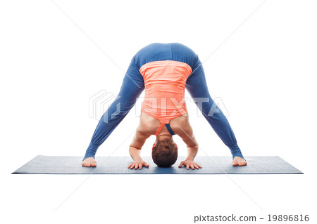 Woman doing yoga asana Prasarita padottanasana 19896816