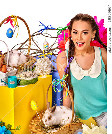 Easter style woman holding rabbits in baskets. 19899664