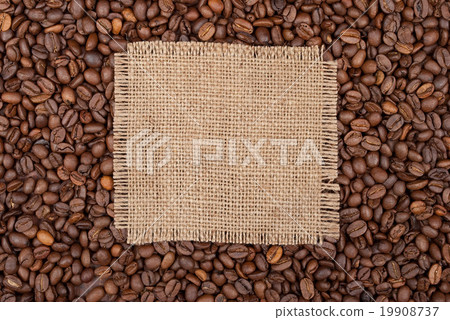 Burlap tag on the background of coffee Burlap tag on the background of coffee 19908737