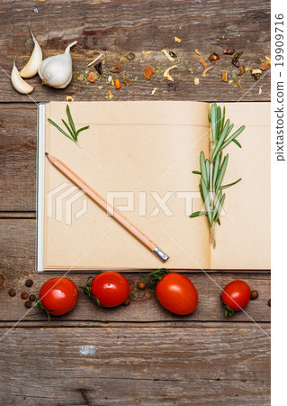 Open blank recipe book on brown wooden background 19909716