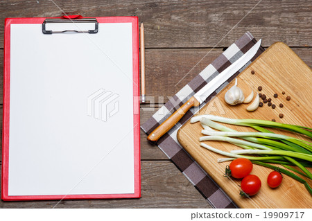 Open blank recipe book on brown wooden background 19909717