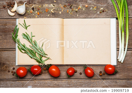 Open blank recipe book on brown wooden background 19909719