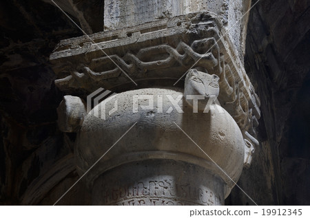 Column with cat heads in medieval christian church 19912345