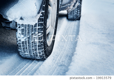 Closeup of car tires in winter  19913579