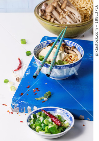 Asian soup ramen with feta cheese 19913716