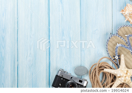 Travel and vacation items on wooden table Travel and vacation items on wooden table 19914024
