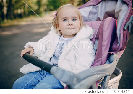 young family walking in the park young family walking in the park 19914845