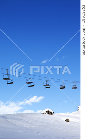 Chair-lift and blue sky at evening 19915252