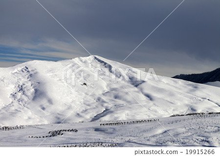 Snowy mountains at sun morning 19915266