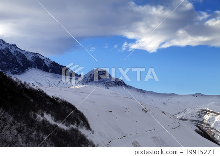 Winter mountains at sun evening 19915271