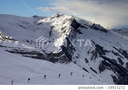 Ski slope with snow cannon at evening 19915272