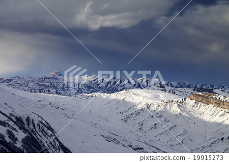 Winter mountains at evening and storm clouds 19915273