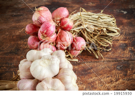 Garlic and onion organic on wooden background Garlic and onion organic on wooden background 19915930
