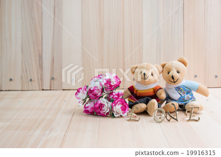 Embrace Bears in love, sit near bouquet rose. Embrace Bears in love, sit near bouquet rose. 19916315