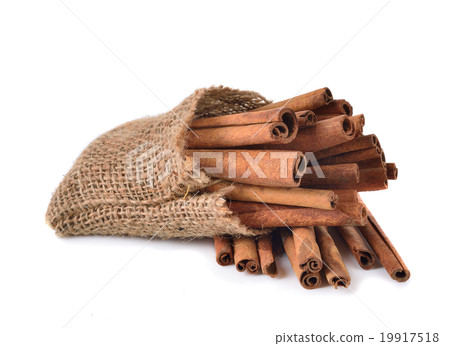 Cinnamon sticks on wooden background 19917518