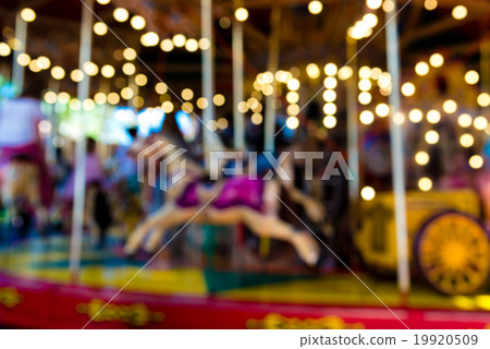 Blurred defocused background of vintage carousel Blurred defocused background of vintage carousel 19920509