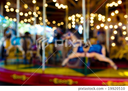 Blurred defocused background of vintage carousel Blurred defocused background of vintage carousel 19920510
