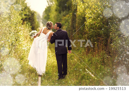 Bride and Groom embracing Bride and Groom embracing 19925513