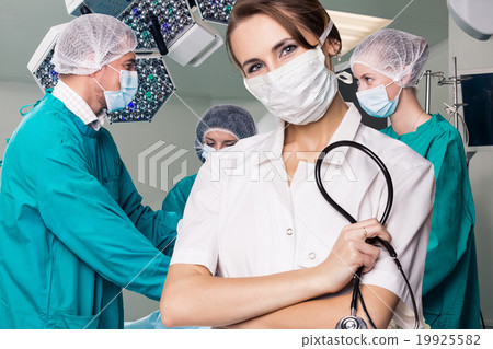 Surgery team operating Surgery team operating 19925582
