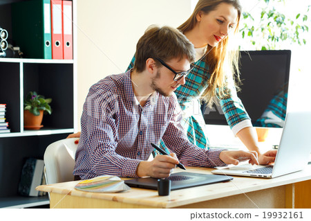 Young woman and man working from home - modern business concept 19932161