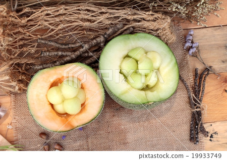 Cantaloupe melon fruit juicy on wood background. Cantaloupe melon fruit juicy on wood background. 19933749