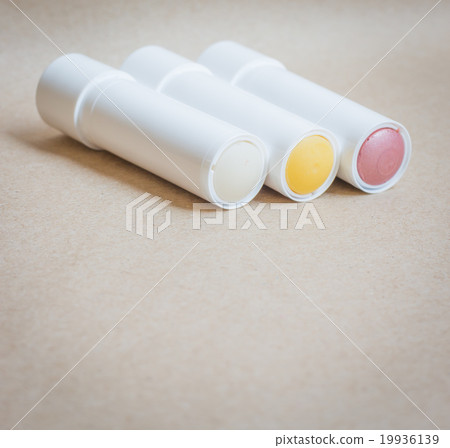 Moisturizer lipstick on brown natural background 19936139