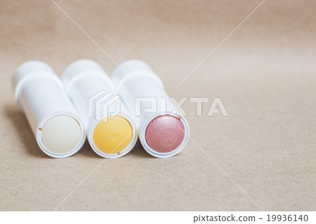 Moisturizer lipstick on brown natural background Moisturizer lipstick on brown natural background 19936140