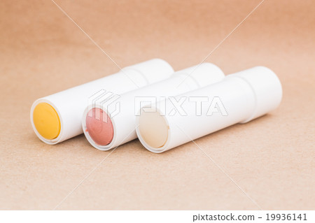 Moisturizer lipstick on brown natural background Moisturizer lipstick on brown natural background 19936141