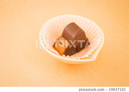 Chocolate pieces on on warm vintage background 19937181