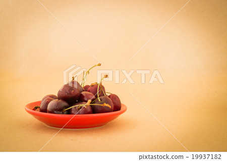 Group of cherries on warm vintage background Group of cherries on warm vintage background 19937182