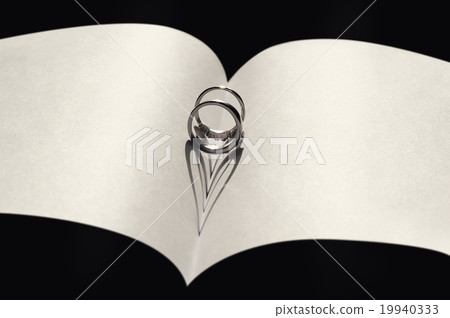 Two wedding rings on a white background Two wedding rings on a white background 19940333