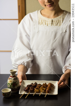 Yakitori Japanese sake offering scene 19943511