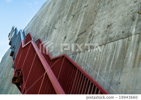 Metal stairs on the gray concrete wall 19943660